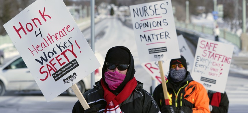 Nurses picket Friday, Feb. 12, 2021 in Faribault, Minn., during a healthcare worker protest of a shortage on protective masks. 