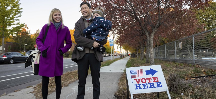 Mayor Jacob Frey casts his vote on Election Day alongside his family at the Marcy Arts Magnet Elementary School on Tuesday, Nov. 2, 2021 in Minneapolis. Frey was among the moderate mayoral candidates who won on Election Day. 