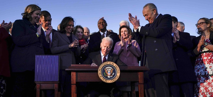 President Joe Biden signs the "Infrastructure Investment and Jobs Act" during an event on the South Lawn of the White House, Monday, Nov. 15, 2021, in Washington.