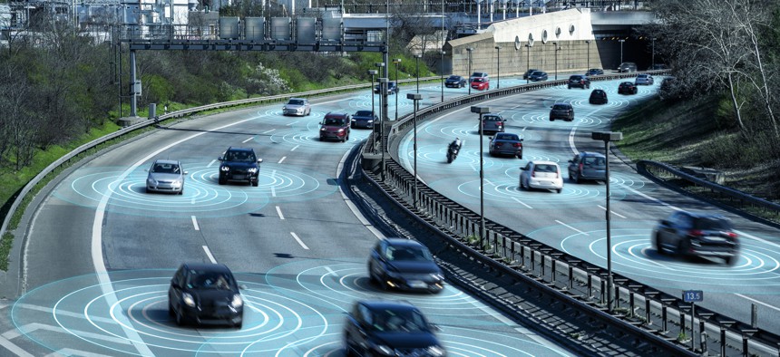 Self driving autonomous cars on multi lane highway. The cars are using radar sensors, wireless communication and artificial intelligence to navigate and communicate with each other.