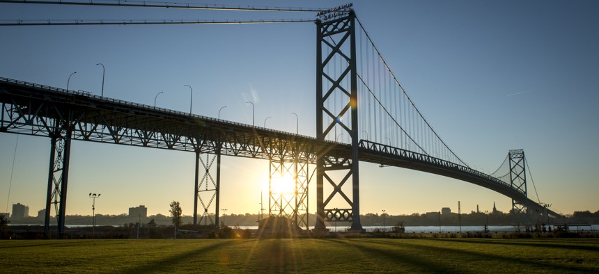 Vehicles travel across the Ambassador Bridge that connects Detroit and Windsor, Canada on November 8, 2021 in Detroit, Michigan.