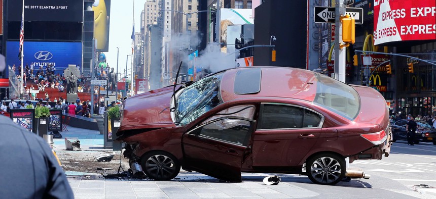 A wrecked vehicle is seen stopped after it plowed into pedestrians on a busy sidewalk in New York City in 2017.