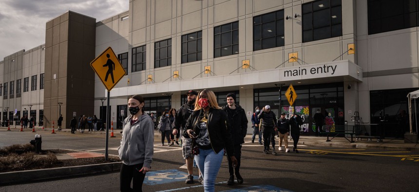 Amazon workers walking out of the Staten Island warehouse after casting their votes.