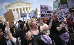 Pro-choice and anti-abortion activists confront one another in front of the U.S. Supreme Court Building on May 03, 2022 in Washington, DC.