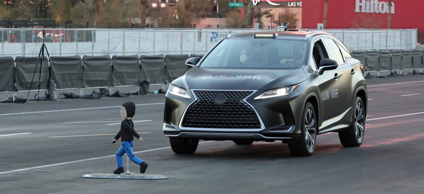 A Lexus with Luminar's lidar technology automatically breaks to avoid colliding with a crash test dummy as part of a safety demonstration.