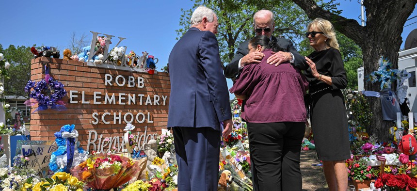 President Biden and wife Jill comfort the principle of Robb Elementary School in Uvalde, Texas after mass shooting there.
