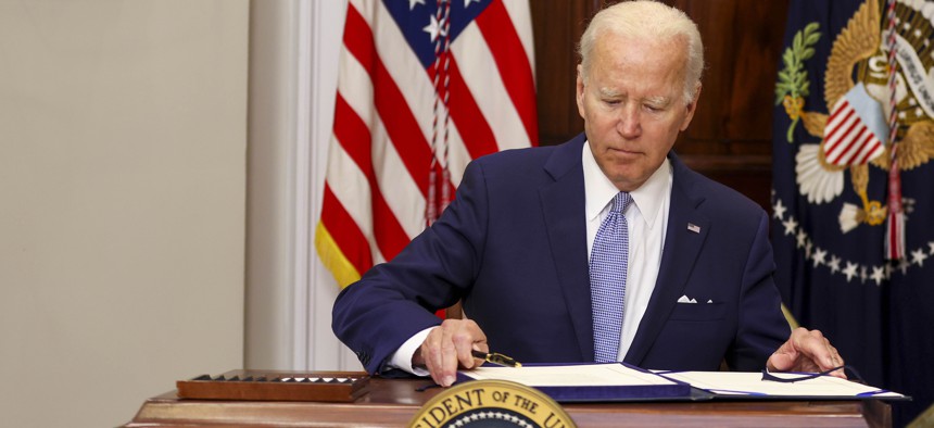 U.S. President Joe Biden signs the Bipartisan Safer Communities Act into law in the Roosevelt Room of the White House on June 25, 2022 in Washington, DC. The legislation is the first new gun regulations passed by Congress in more than 30 years.