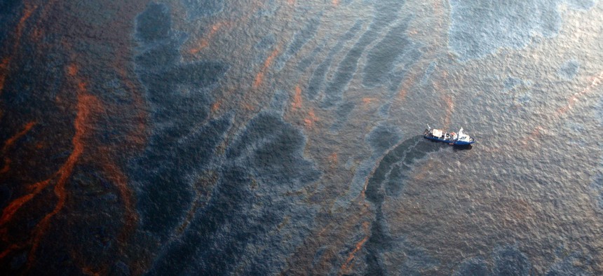 A boat works to collect oil that has leaked from the Deepwater Horizon wellhead in the Gulf of Mexico on April 28, 2010 near New Orleans, Louisiana. 