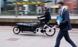 A staff member rides an electric bike during an eCargo bike launch in Manchester, Britain, on Jan. 17, 2022. A U.S. safety group is telling cities they should prepare for new types of vehicles on their streets, possibly including bulkier bikes like these.