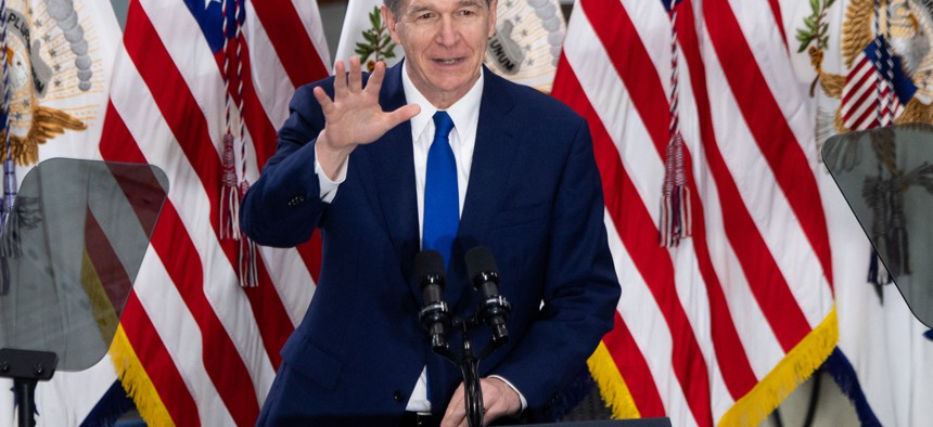 North Carolina Gov. Roy Cooper, shown in this April 2021 file photo, signed an executive order providing additional support to state employees with autism spectrum disorder. The pilot program provides state workers with autism with free career coaching.