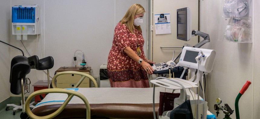 Julie Burkhart, co-owner of the Hope Clinic For Women, looks at an ultrasound machine inside an exam room in Granite City, Illinois, on June 27, 2022. 