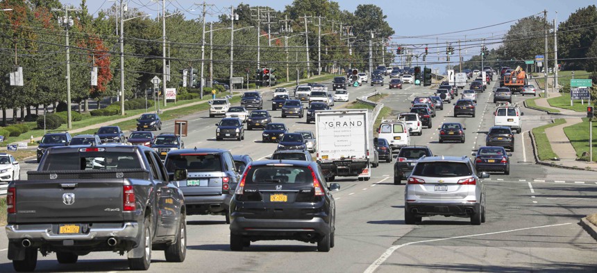 Traffic moves along a section of State Route 347 in Lake Grove, New York.
