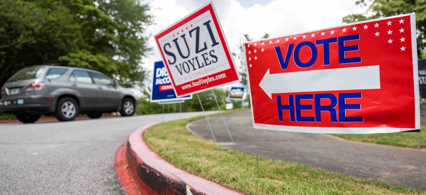 Election signs are seen on election day for the Georgia primary election on May 24th, 2022 at Spalding Drive Elementary School in Atlanta, Georgia. 
