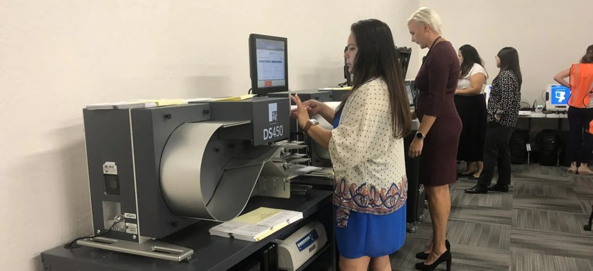 Yuma County elections staff test tabulators as part of the county’s logic and accuracy test on June 30.