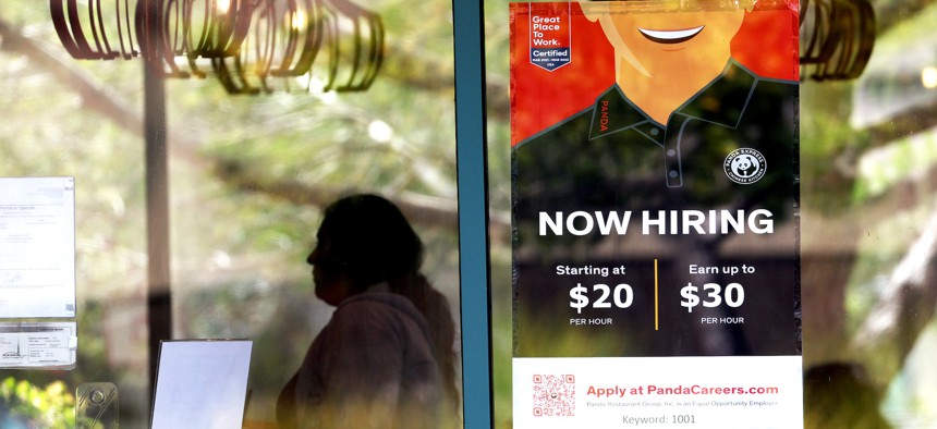 A now hiring sign is posted at a Panda Express restaurant in August in Marin City, California.