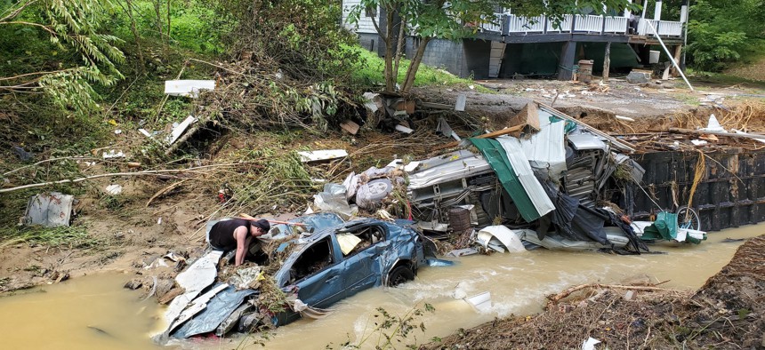 Photo taken on July 30, 2022 shows a house and vehicles destroyed by heavy rain-caused flooding in Central Appalachia in Kentucky, the United States. Dozens of people died as a result of the flooding. 