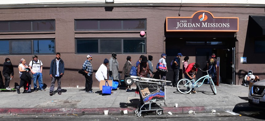 People wait in line for a free morning meal in Los Angeles in April 2020. High and rising inequality is one reason the U.S. ranks badly on some international measures of development.
