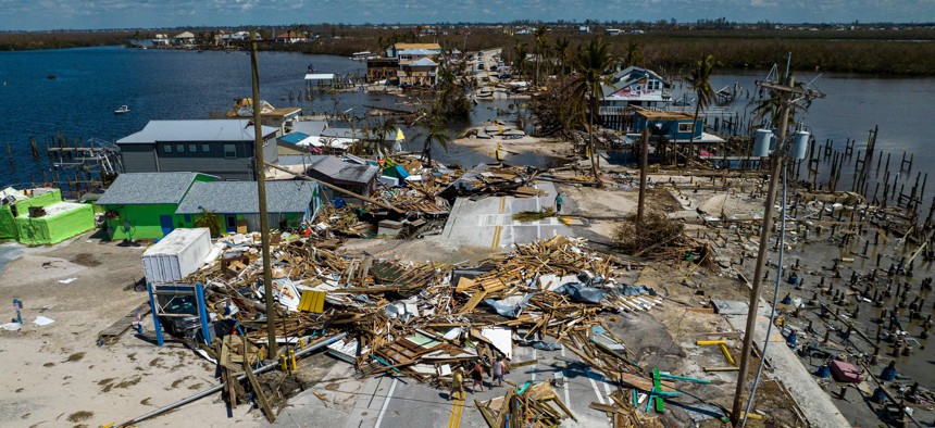 Downed houses and debris line Pine Island Road in Matlacha, Florida, after Hurricane Ian on Oct. 1, 2022. 