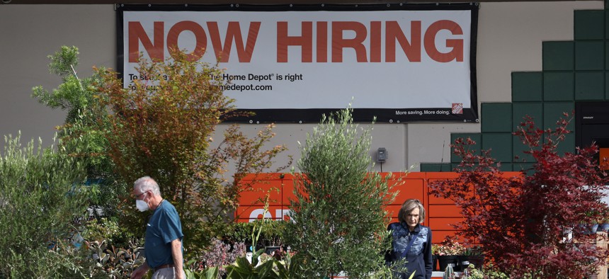 A "now hiring" sign is posted at a Home Depot store on August 05, 2022 in San Rafael, California.