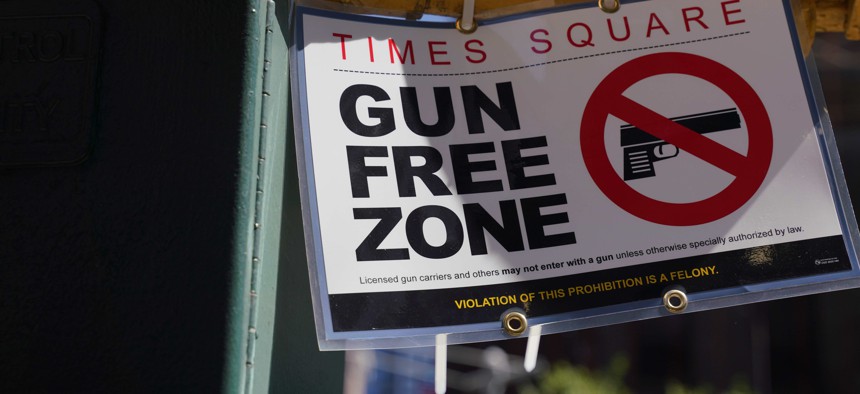 Signs announcing a "gun-free zone" were posted at every entry and exit point of Times Square in early September as a New York law limiting where firearms can be legally carried in public was set to go into effect.