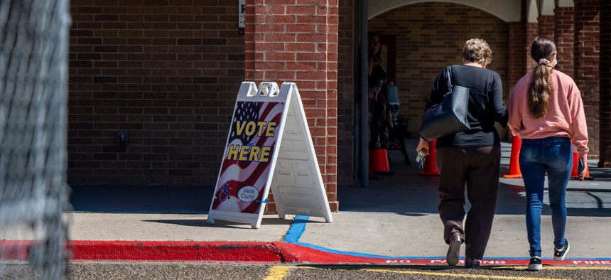 Kenya Mariscal (R), walks with her aunt, Bertha, to a polling station on March 01, 2022 in Laredo, Texas.