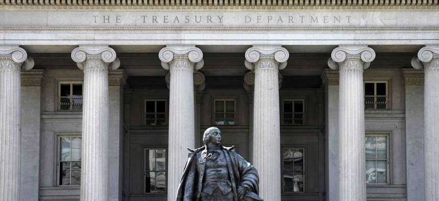  A statue of Albert Gallatin, a former U.S. Secretary of the Treasury, stands in front of The Treasury Building in Washington, D.C. 