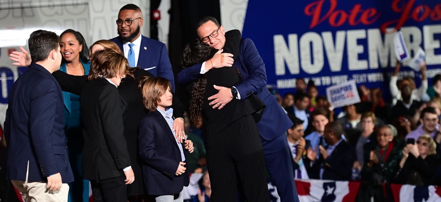 Democratic gubernatorial nominee Josh Shapiro embraces his family after giving a victory speech to supporters at the Greater Philadelphia Expo Center n Oaks on Election Day. 