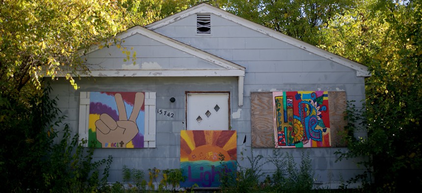 Art is placed on the front of the majority of the abandoned houses in the neighborhood of Brightmoor seen on October 15, 2015 in Detroit, Michigan. 