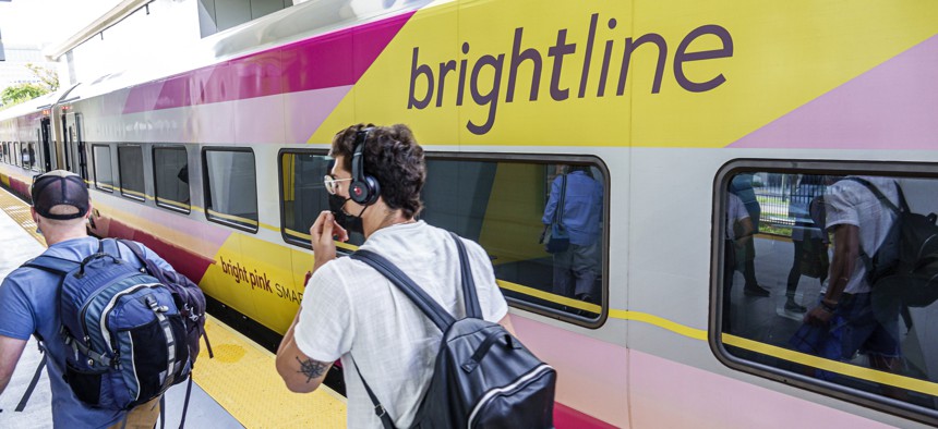 Passengers board a Brightline train in West Palm Beach, Florida.