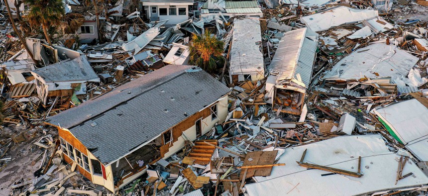 Heavily damaged mobile homes are seen in Fort Myers Beach, Florida, a month after Hurricane Ian made landfall as a Category 4 hurricane, causing an estimated $67 billion in insured losses.