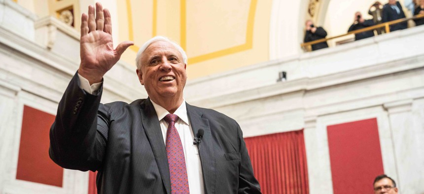 Gov. Jim Justice waves while at the state Capitol to give his 2023 state of the state address.