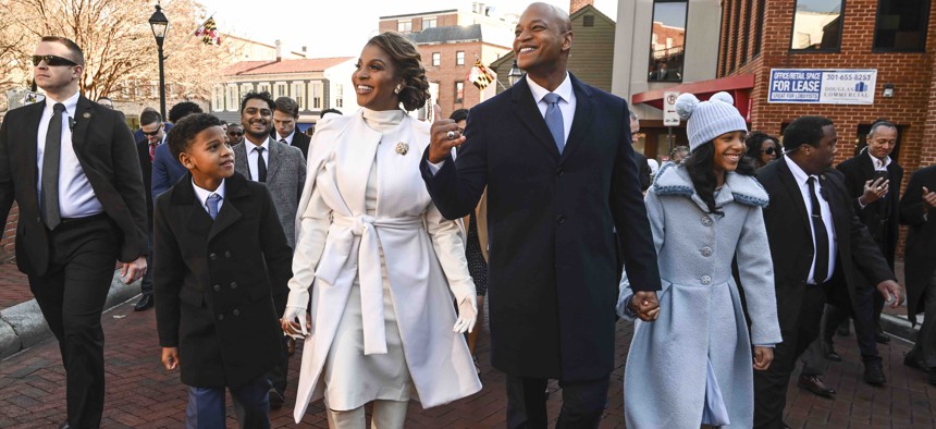 Maryland Governor-elect Wes Moore along with his wife Dawn Flythe and their two children James and Mia, walk to the Maryland State House following a wreath laying ceremony prior to the gubernatorial inauguration on January 18, 2023 in Annapolis, Md.