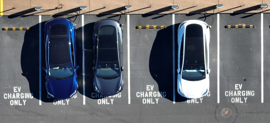 Tesla cars recharge at a Tesla charger station on February 15, 2023 in Corte Madera, California. Electric car company Tesla is partnering with the U.S. federal government to expand electric vehicle charging infrastructure in the United States. 