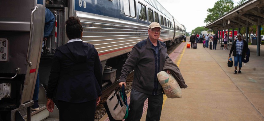 Passengers disembark an Amtrak passenger train in Wilson, North Carolina in 2019.