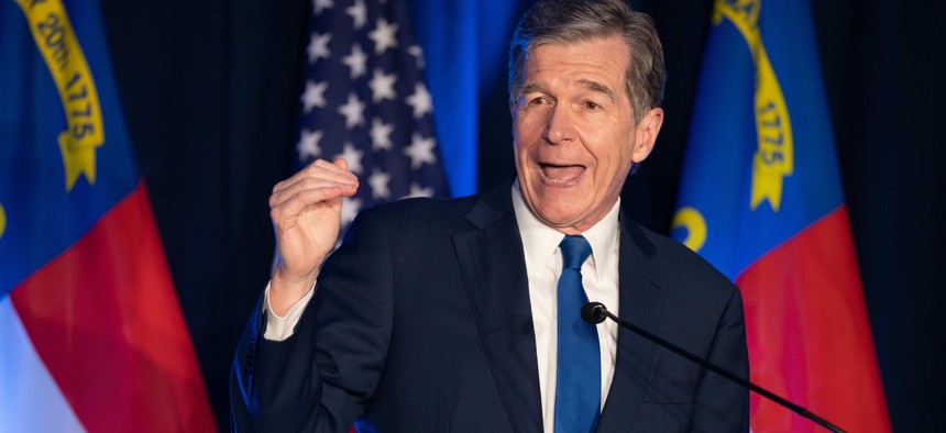 North Carolina Gov. Roy Cooper, a Democrat, faces higher hurdles to sustaining his vetoes after a lawmaker switched parties to hand Republicans a supermajority in the state legislature.