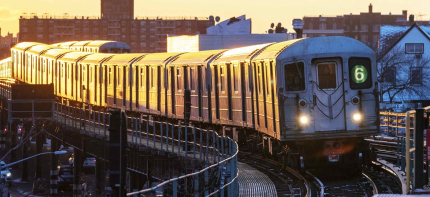 The setting sun shines on a subway train as it makes it's way into the station in New York.
