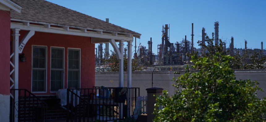 An active oil refinery is located next to a single family home on September 21, 2022 in Wilmington, California.