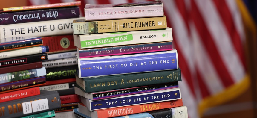 Copies of banned books from various states and school systems from around the county are seen during a press conference in Washington, D.C.