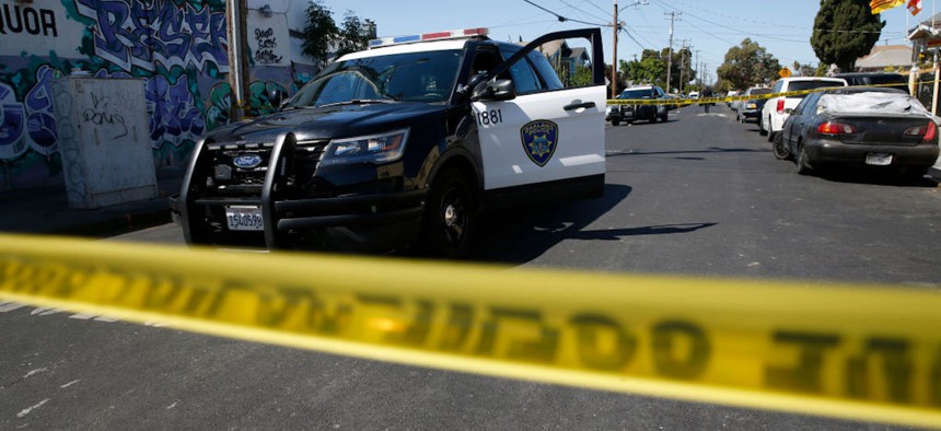 Oakland police investigate the scene of a homicide on 83rd Avenue near International Boulevard in Oakland, California, on Thursday, May 20, 2021. A man was found dead after police responded to a ShotSpotter alert.