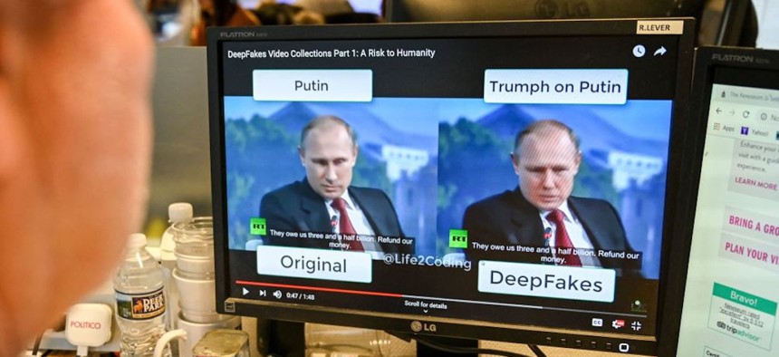 An AFP journalist at his newsdesk in Washington, D.C., views a video manipulated with artificial intelligence, or a "deepfake," to potentially deceive viewers on January 25, 2019.