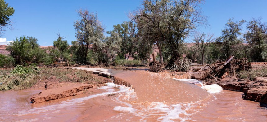 Floodwaters overflow the Mill Creek Parkway after a flash flood in Moab, Utah, in August 2022. 