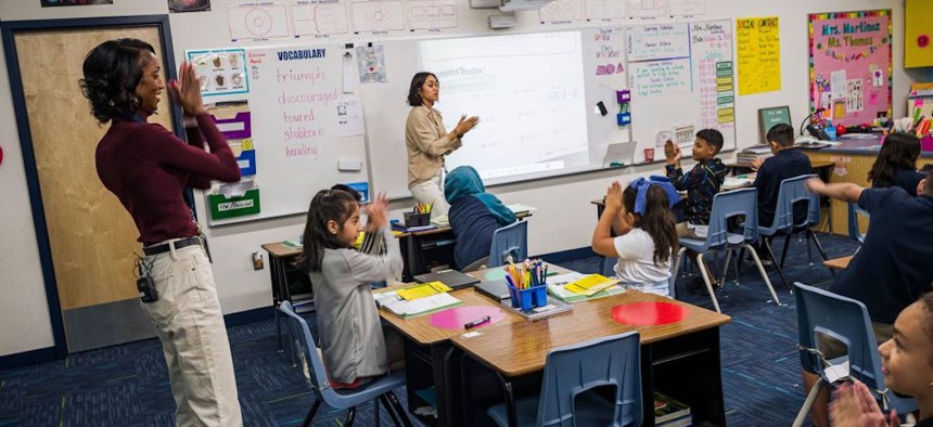 Teachers engage with students at Nevitt Elementary School in Phoenix, Arizona, on October 26, 2022.