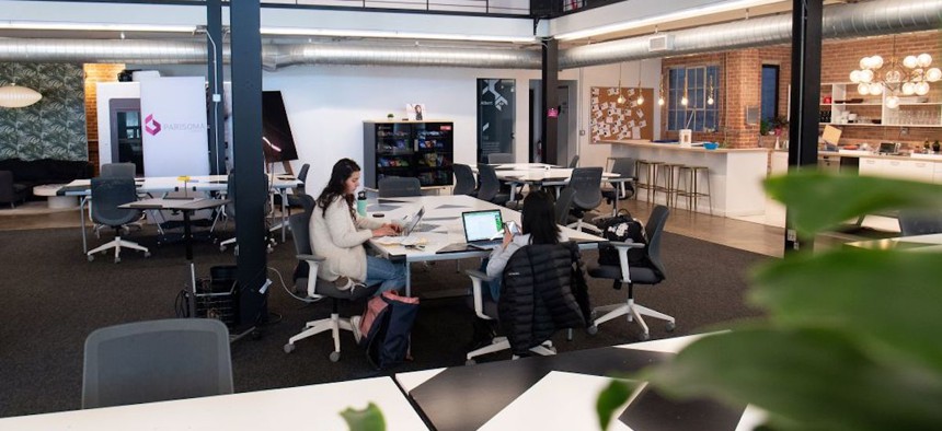 Workers sit in Parisoma, a coworking space, in San Francisco, California, on March 12, 2020.