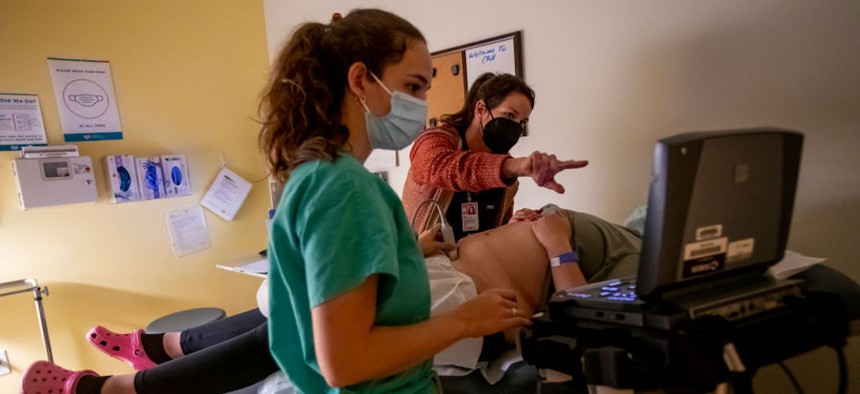 A family physician and her resident perform an ultrasound on a 25-year-old woman the day before the Supreme Court overturned Roe v. Wade at the Center for Reproductive Health clinic on June 23, 2022, in Albuquerque, New Mexico. The woman later had a medication abortion.