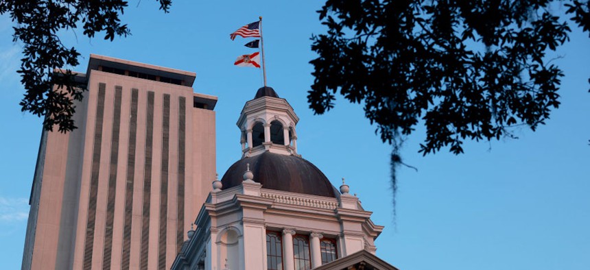 The Florida Historic Capitol sits near the 22-story New Capitol building, which together are part of the Capitol Complex on July 26, 2023 in Tallahassee, Florida.