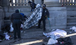 New York City police officers clear an encampment after Mayor Eric Adams ordered the city to enforce homeless sweeps.