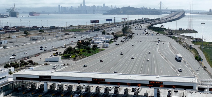 Vehicles head back and forth across the Bay Bridge during the afternoon commute in Oakland, Calif., in June. 