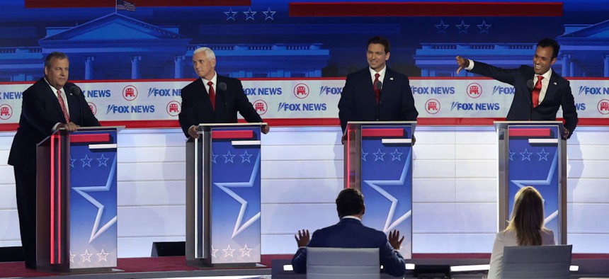 Republican presidential candidates (L-R), former New Jersey Gov. Chris Christie, former U.S. Vice President and Indiana Gov. Mike Pence, Florida Gov. Ron DeSantis and Vivek Ramaswamy participate in the first debate of the GOP primary season hosted by FOX News at the Fiserv Forum in Milwaukee, Wisconsin, on Aug. 23, 2023. 