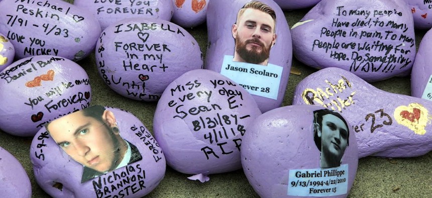 Painted stones in memory of those who died of drug overdoses sit outside the Suffolk County Legislature Building on Fentanyl Awareness Day in Smithtown, New York, on May 9, 2023. 