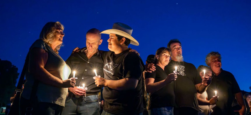 Community members join a candlelight vigil in honor of the victims of an Aug. 23 shooting at Cook's Corner bar in Trabuco Canyon, California, on Sept. 6 2023. Three victims were killed, and six were injured. 